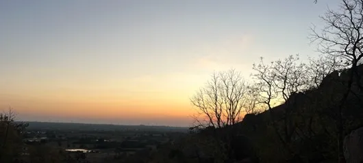 Sunset over boulders with starry sky